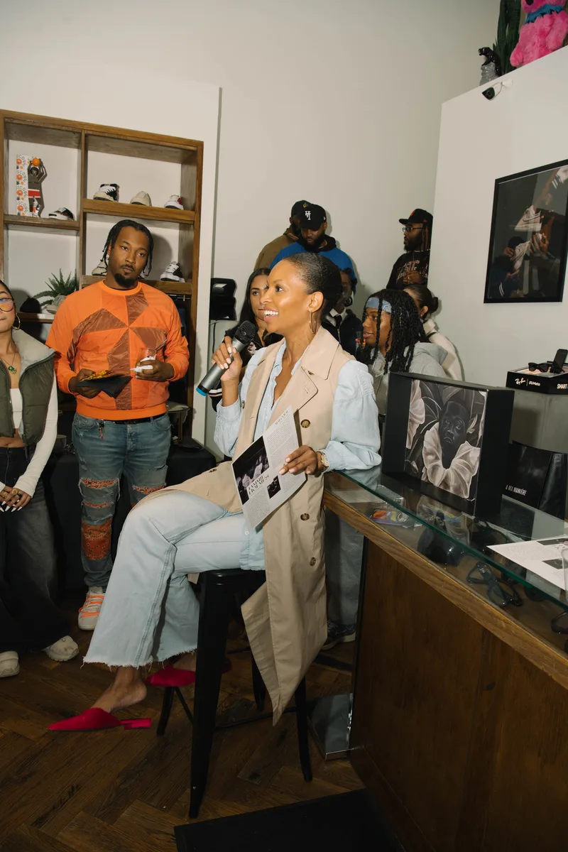 Alex Delotch Davis speaking in an intimate gallery setting